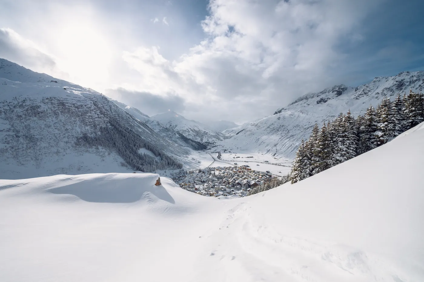 Andermatt village in the snow seen from above